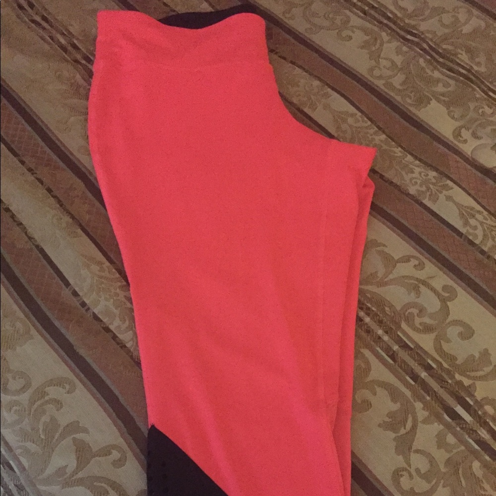 Fluorescent pink and black capri leggings